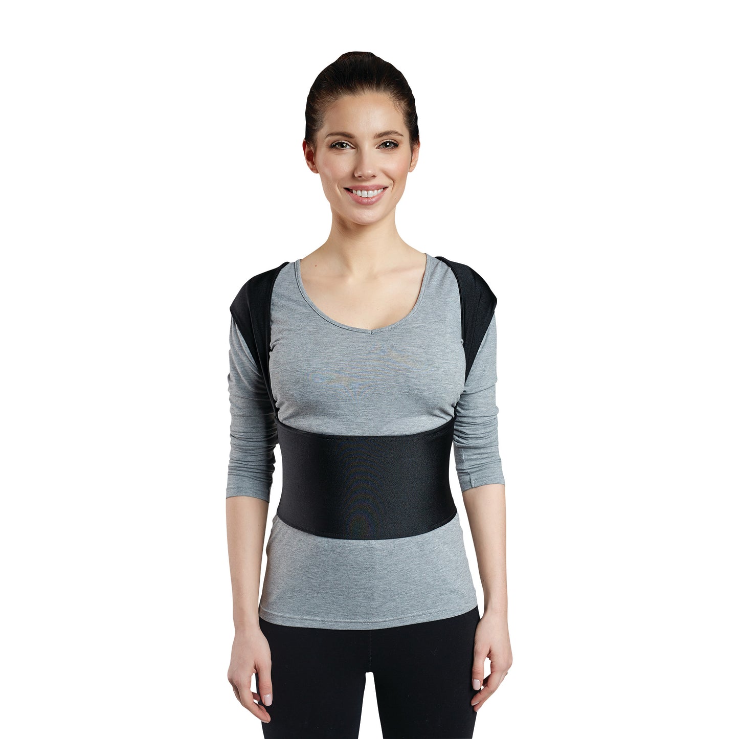 A person wearing the Femi Posture, a back support brace with shoulder straps and a waist belt, over a grey top.