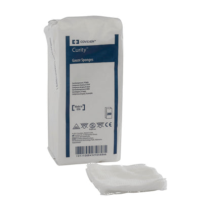 Package of Coviden Curity Gauze Sponges with blue and white labeling, showing a stack of gauze sponges beside it.