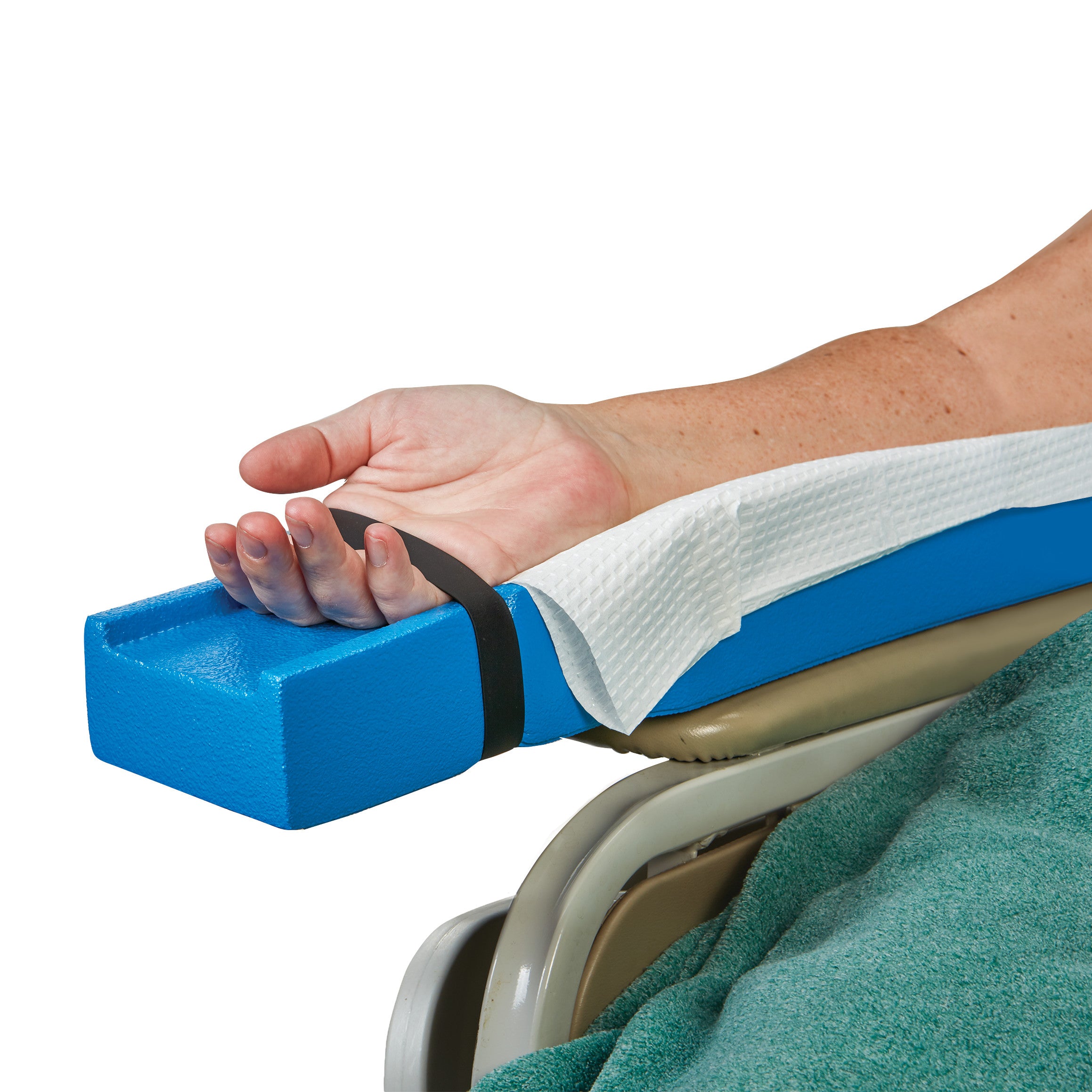 A hand rests on a blue AliMed Dialysis Arm Positioner with a Medium Loop securing the wrist, atop a covered medical chair.