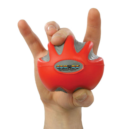 A hand holds a CanDo Digi-Squeeze Hand Exerciser, a red and gray grip strength tool shaped like a ball with finger grooves.