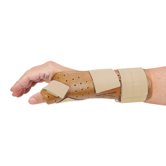 A hand wearing the AliMed FREEDOM Thumb Spica, a brown brace with blue straps, designed to support the thumb and wrist.