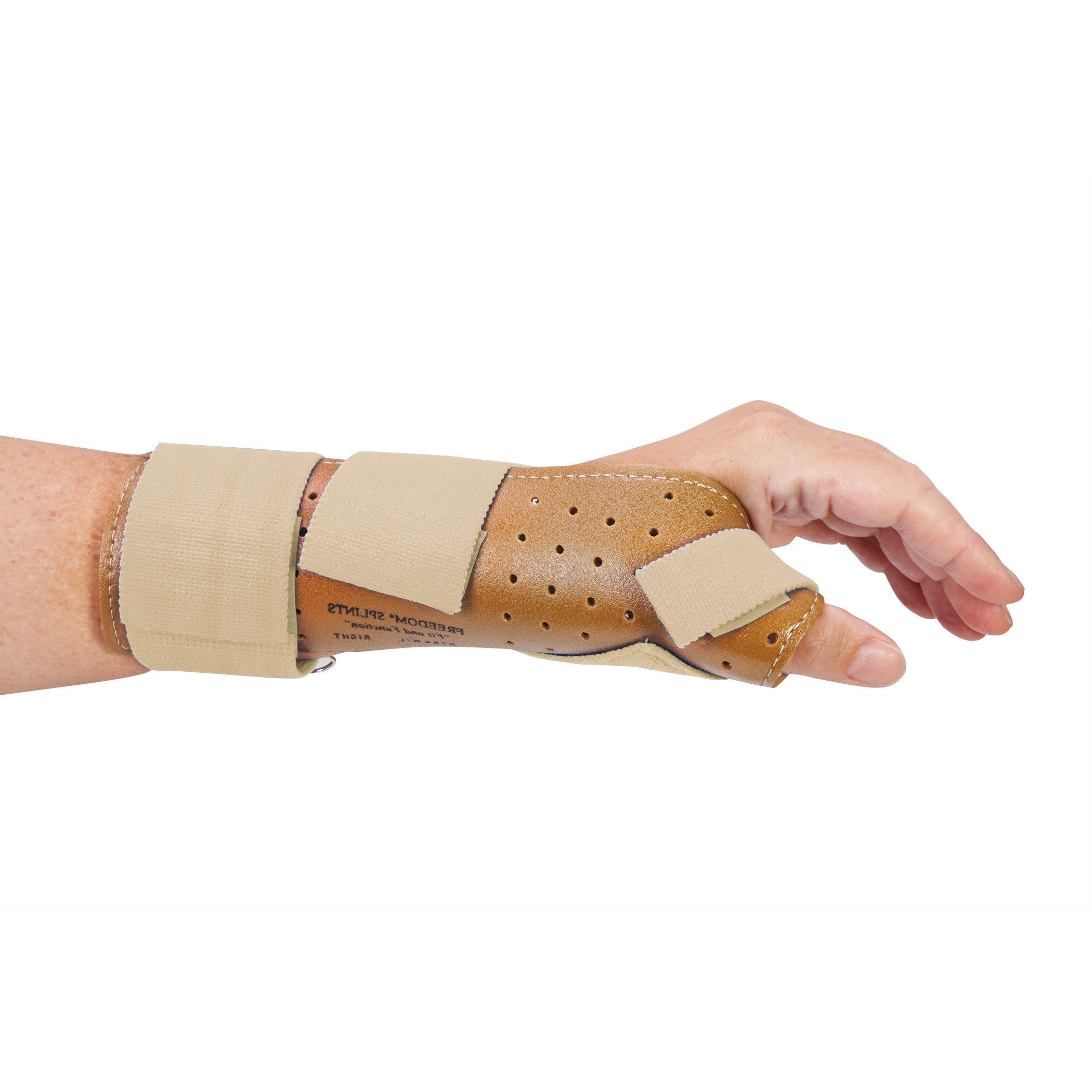 A person wears the AliMed FREEDOM Thumb Spica, a supportive brown and blue brace stabilizing the thumb and wrist.