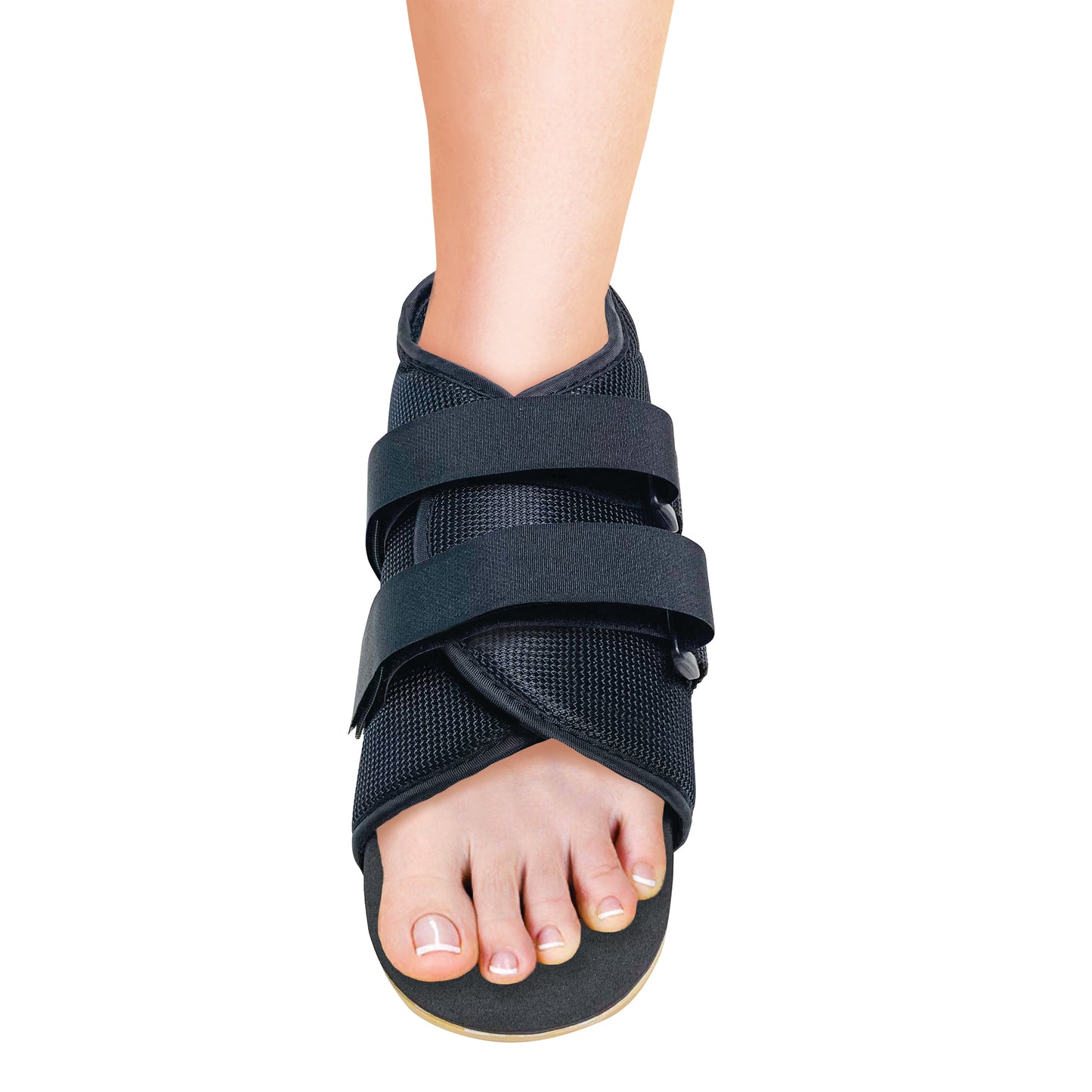 A person's foot in a Canvas Post-Op Shoe with black mesh and adjustable straps, leaving toes visible from the front.