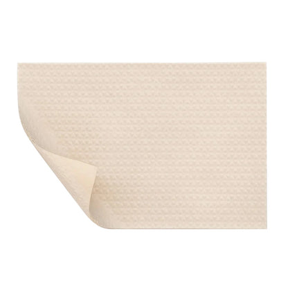Molnlycke Mepiform Self-Adherent Soft Silicone Dressing with a light beige color and textured surface, shown with a corner slightly curled.