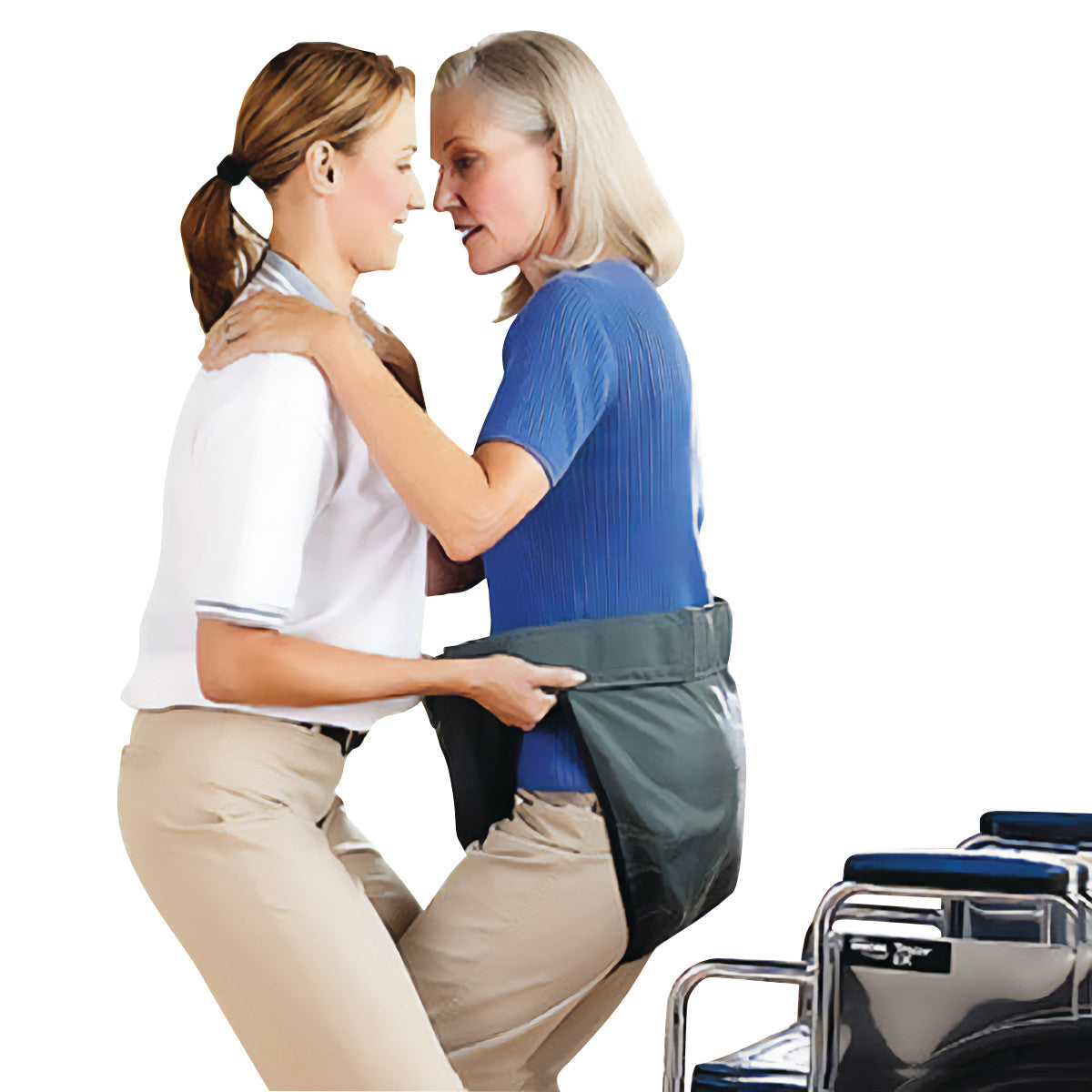A caregiver assists an elderly woman using the SafetySure Mary's Aide Transfer Lift Assist, with a wheelchair nearby.