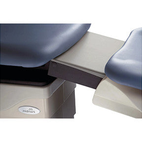 Close-up of a Midmark Basic Podiatry Procedure Chair, Model 646. It shows the extendable foot section with grey and blue padding.