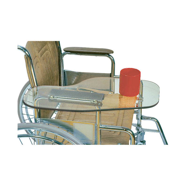 Therafin Transparent Flip-Away Arm Support attached to a wheelchair with a red cup on top. It provides a clear, flat surface.