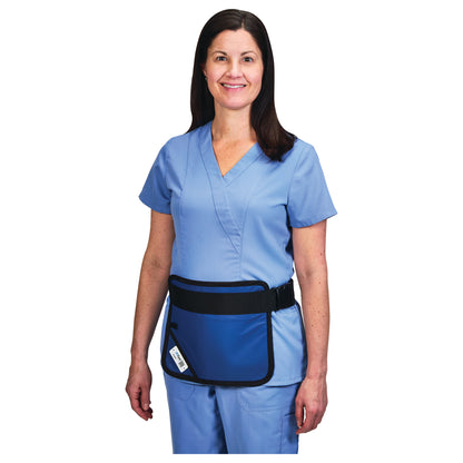A person wearing an AliMed Mini Apron over light blue medical scrubs. The apron is blue with a black strap and pocket.