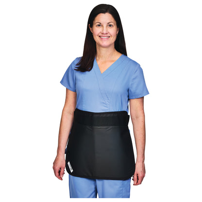 A person wears the AliMed Mini Apron in black over blue medical scrubs, featuring a waist strap for support.
