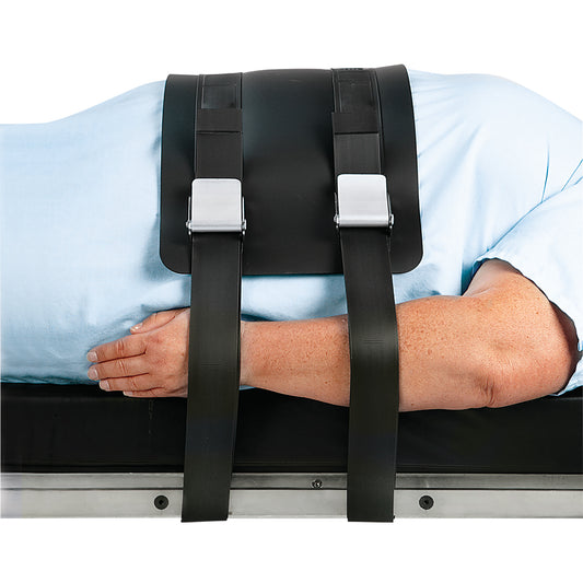 A person is lying on a table secured with the AliMed VeriClean Bariatric Operating Room Table Strap with Mid-Panel.