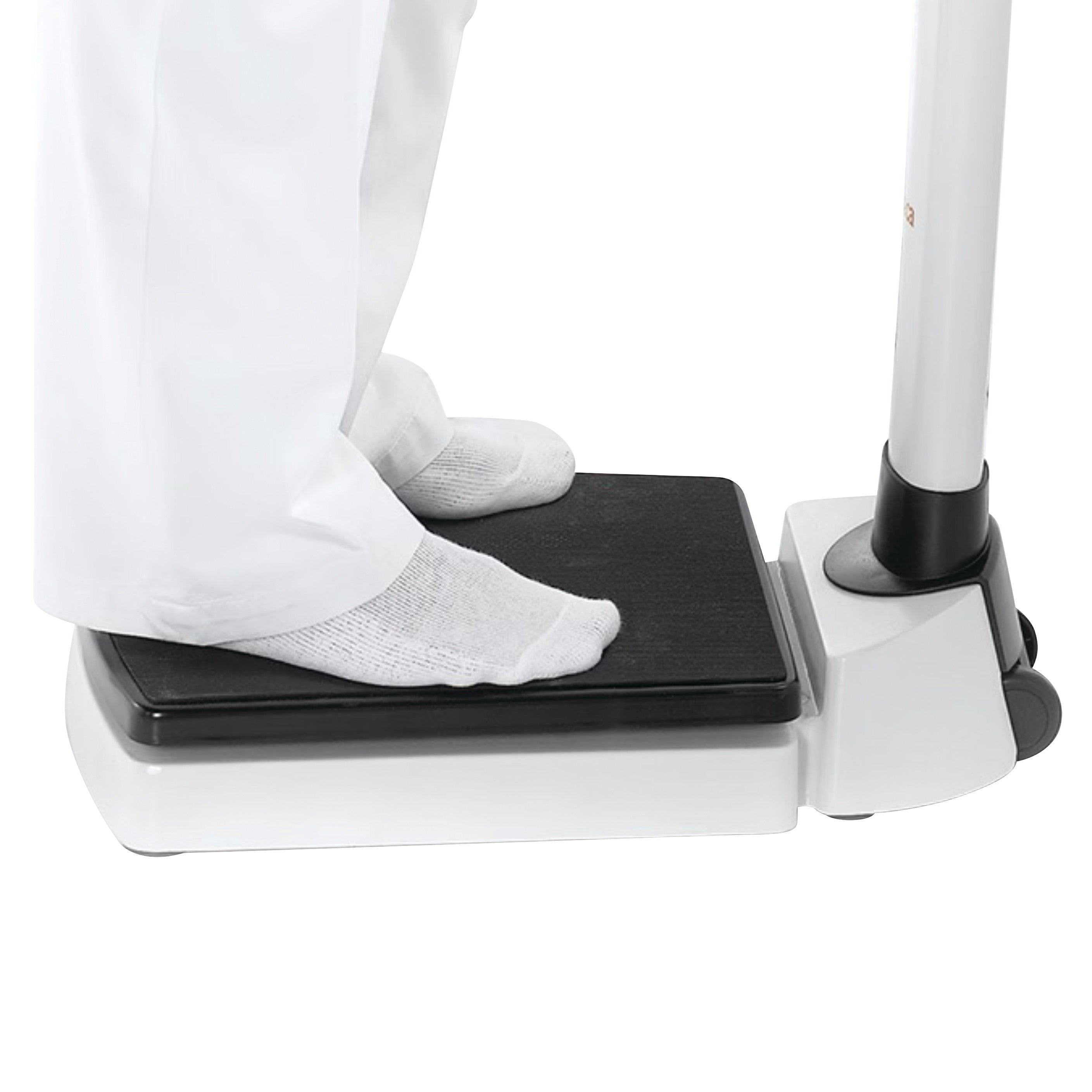 Person standing on a seca 703 Column Scale, wearing white pants and socks.