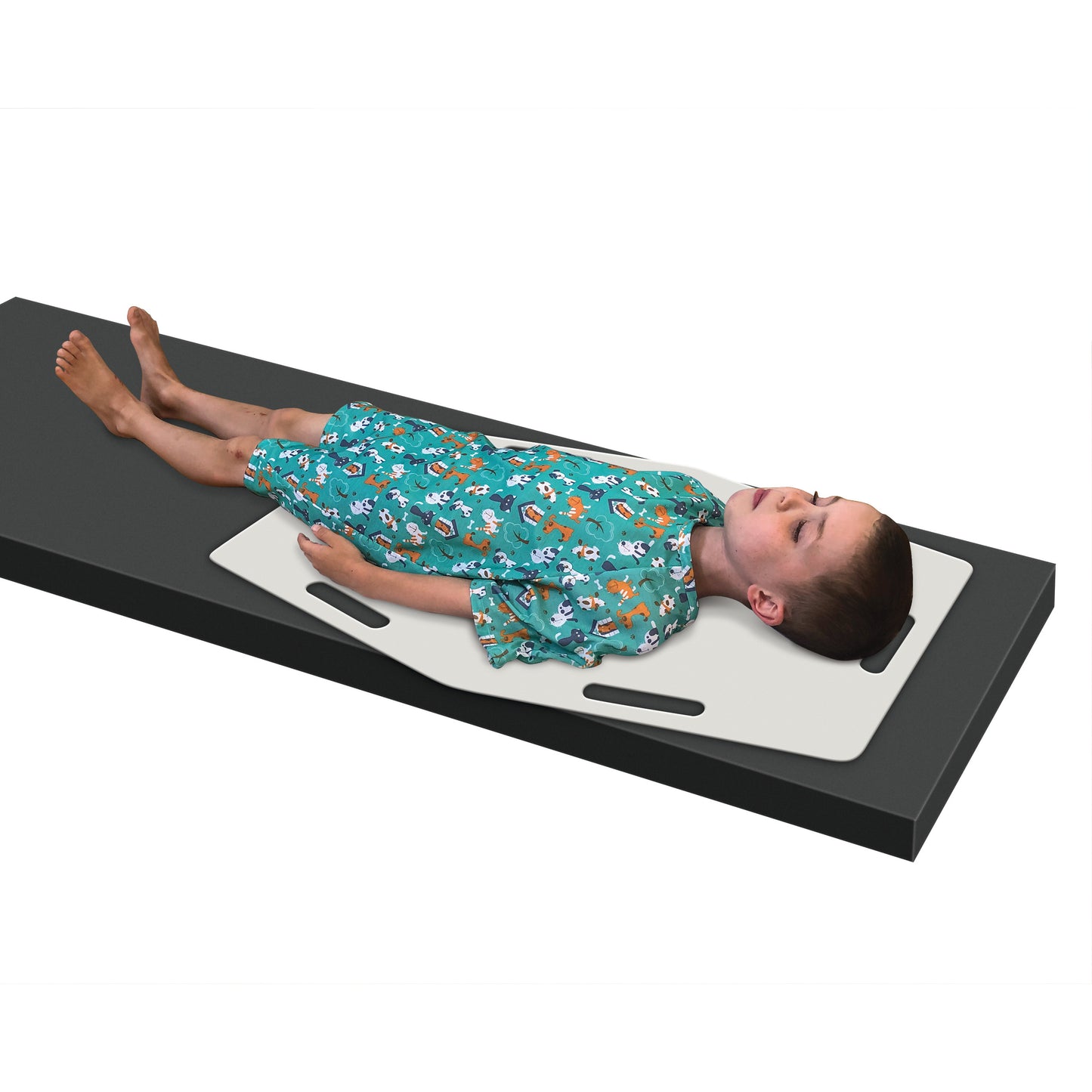 A child lies on an AliMed AliSlide Half Shifter, a white sliding board, wearing a green hospital gown with animal prints.