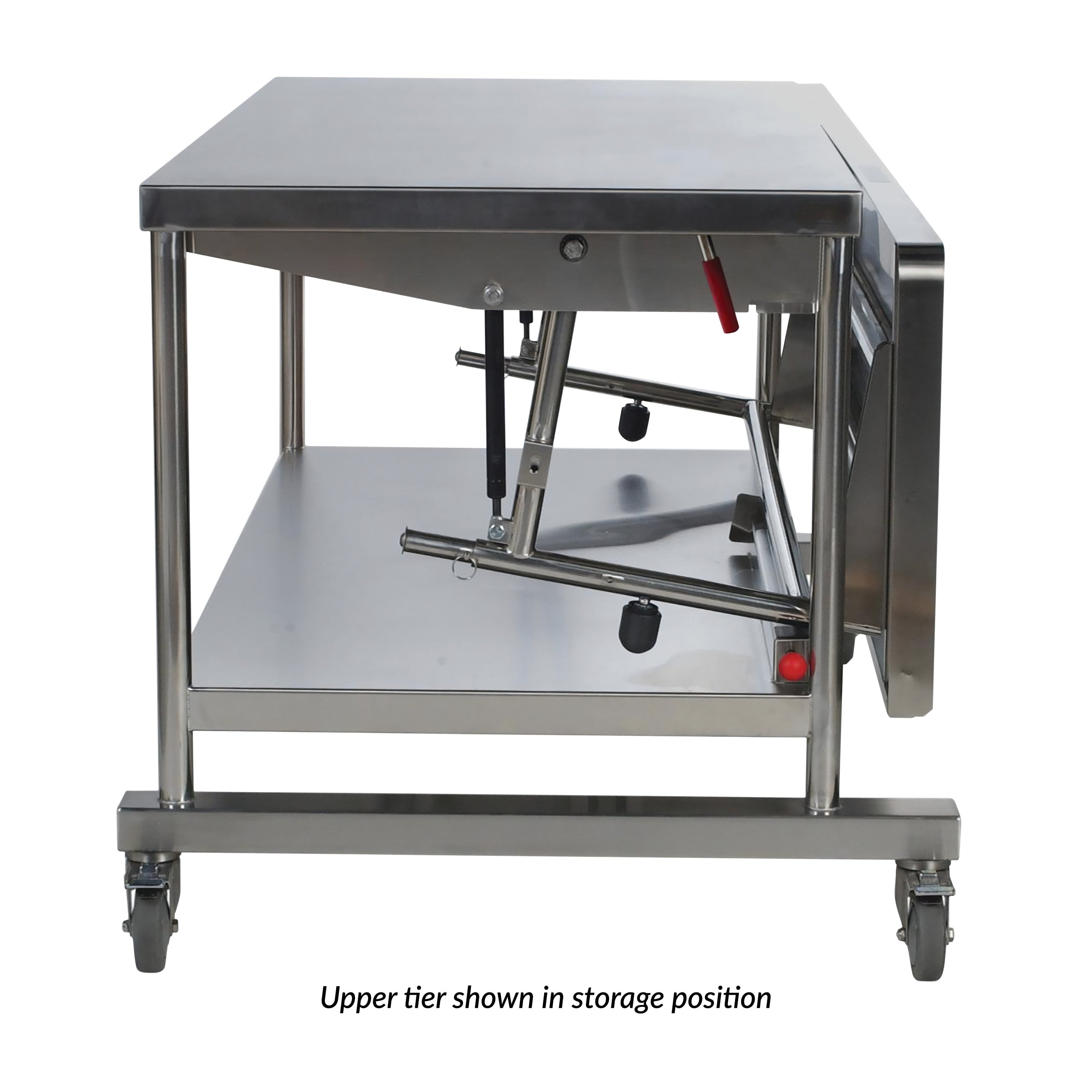 The Pedigo Space Station, a stainless steel medical cart with a collapsible upper tier, on wheels, shown in storage position.