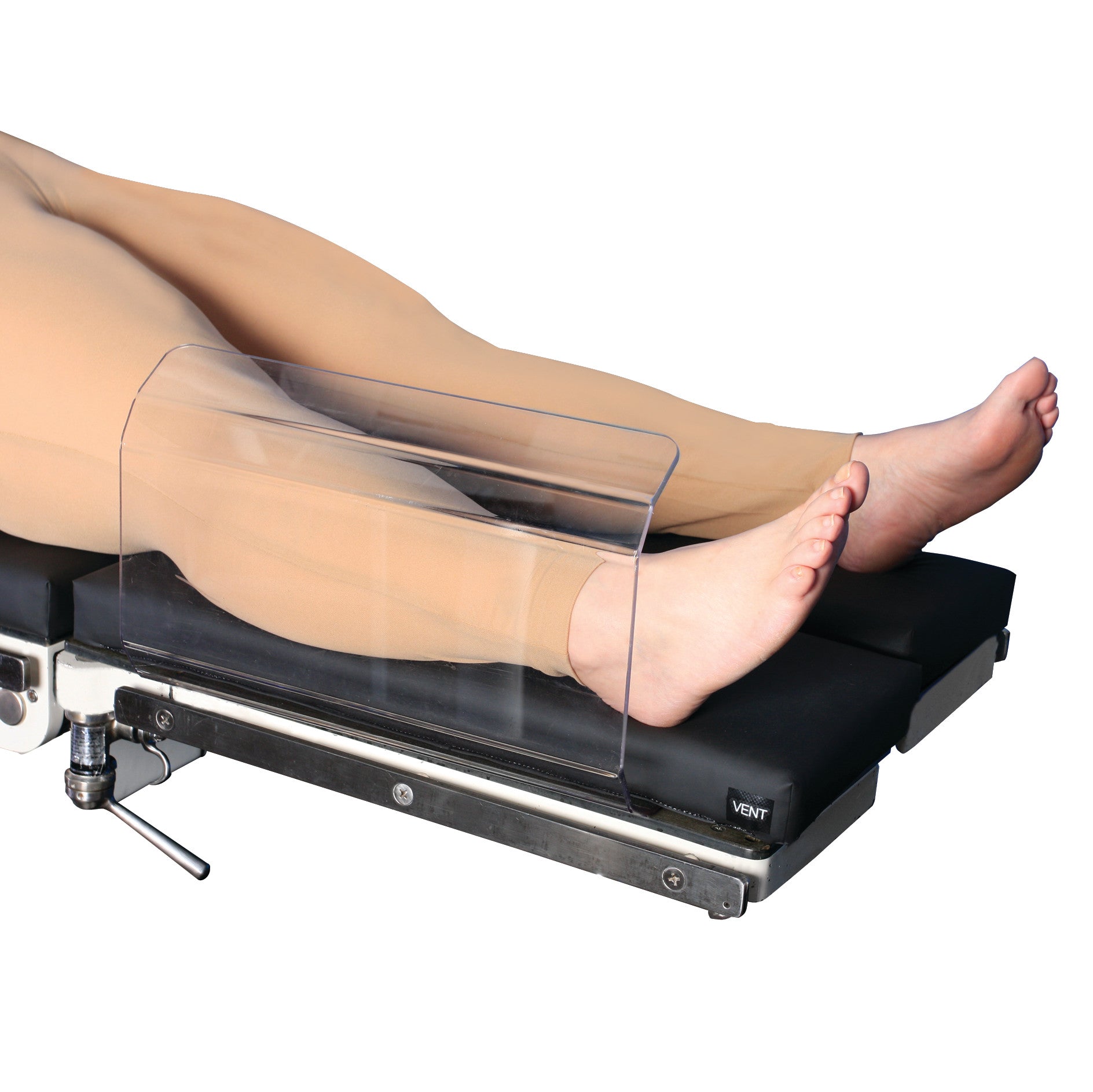 An AliMed Curved Toboggan Arm/Leg Guard protecting a patient's legs on a medical table.