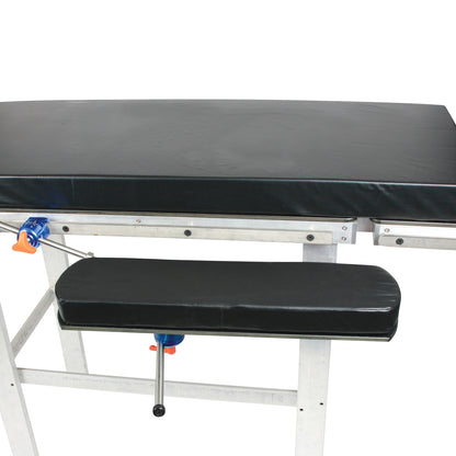 The AliMed Versa-Board, a black padded medical support board with metal adjustable brackets and clamps.