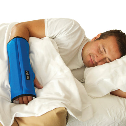 A person sleeps on their side, wearing the Brownmed IMAK RSI Pil-O-Splint, a blue arm brace, resting on white bedding.