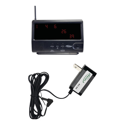 A Smart Caregiver Economy Central Monitor with a digital display, antenna, buttons, and a connected AC adapter plug.