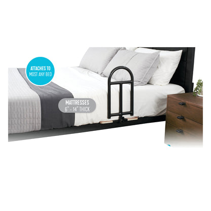 A Stander BedCane attached to the side of a bed with a white and gray quilt. Compatible with mattresses 6'-14' thick.