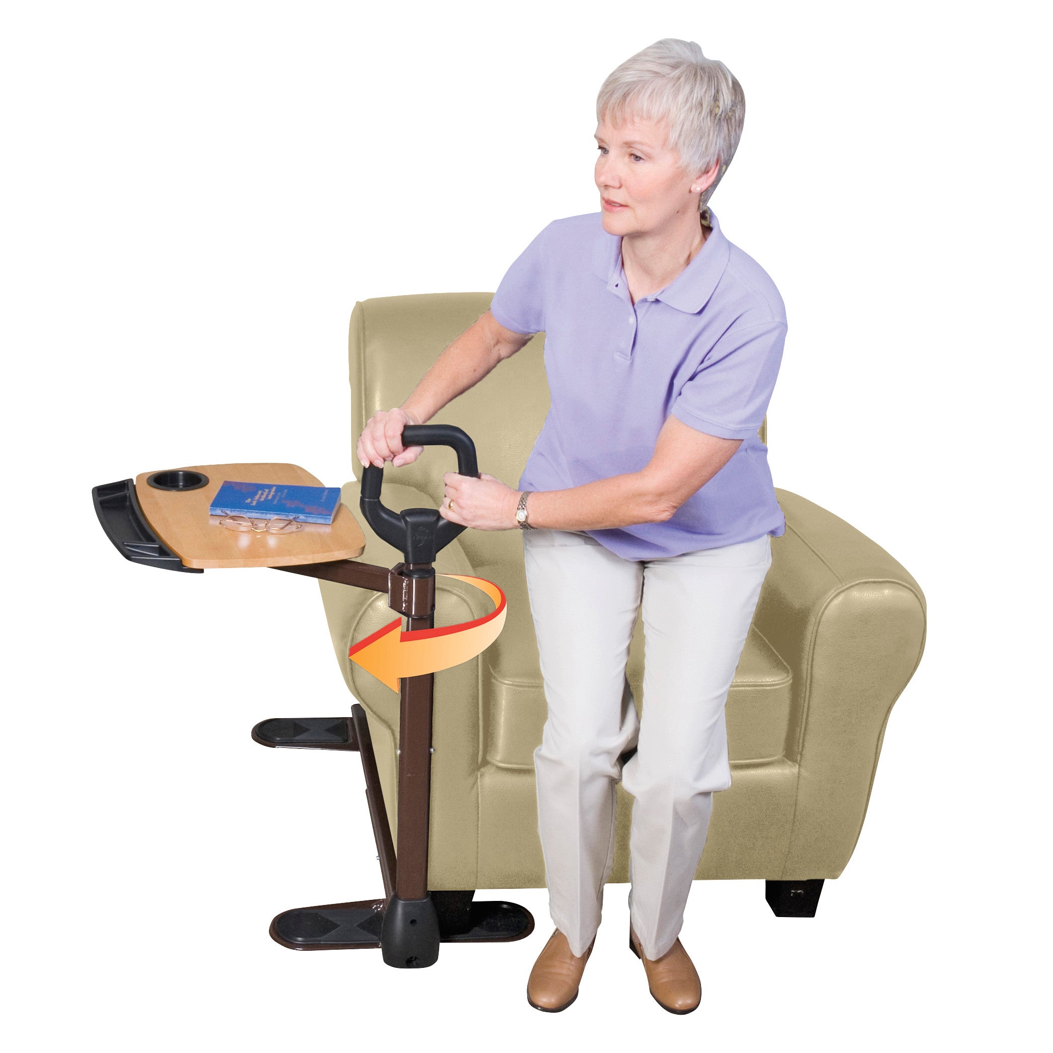 A woman uses an Assist-A-Tray to help stand from a chair, featuring a support handle and a wooden tray with a cup holder.