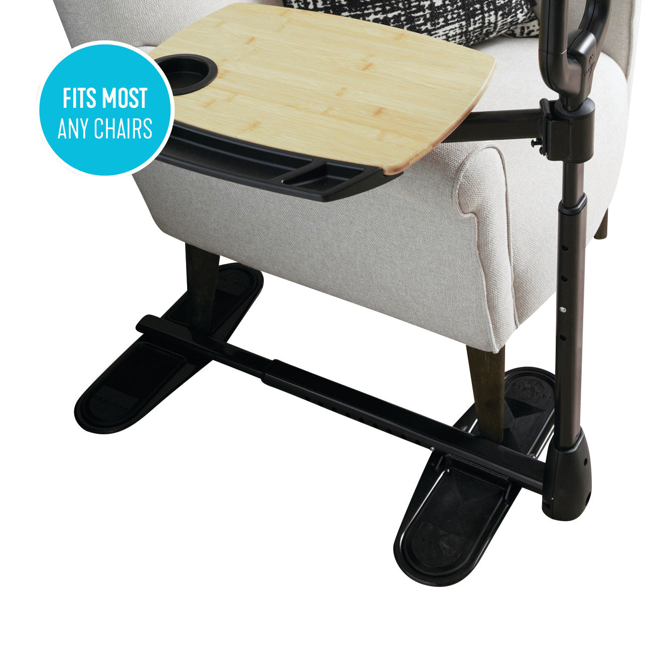 An Assist-A-Tray attached to a beige armchair, featuring a wooden tray with a cup holder and a sturdy black base.