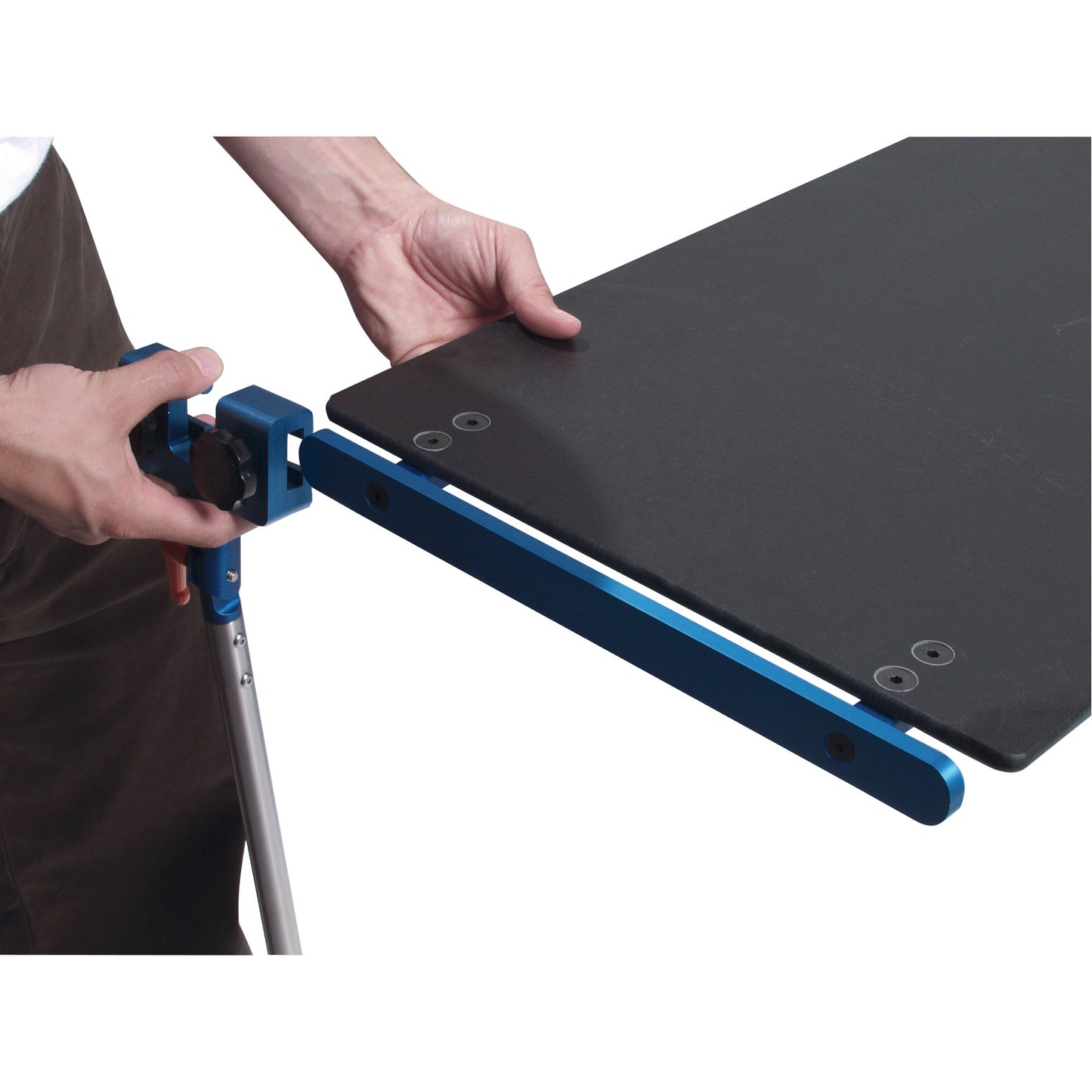 A person attaches an Attachable Hand Table Leg with a blue metal bracket to a black tabletop, securing it with a knob.