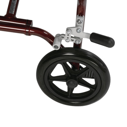 Close-up of the rear wheel and brake mechanism of the Drive Medical Fly-Lite Aluminum Transport Chair, featuring a red frame.