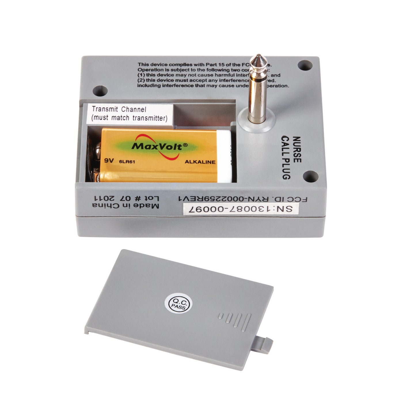 An AliMed Nurse-Call Device with an open battery compartment, revealing a 9V MaxVolt alkaline battery.