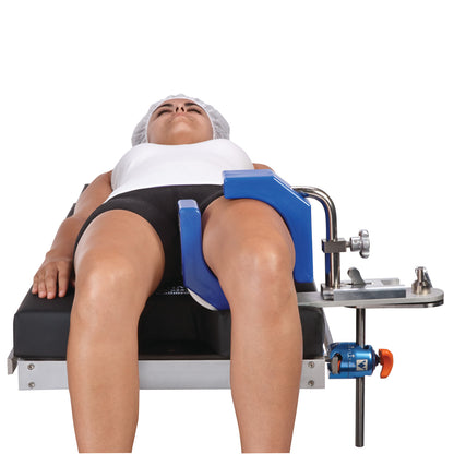 A person is lying down with their leg secured in an AliMed Fluid-Proof Arthroscopic Leg Holder, featuring blue padding.