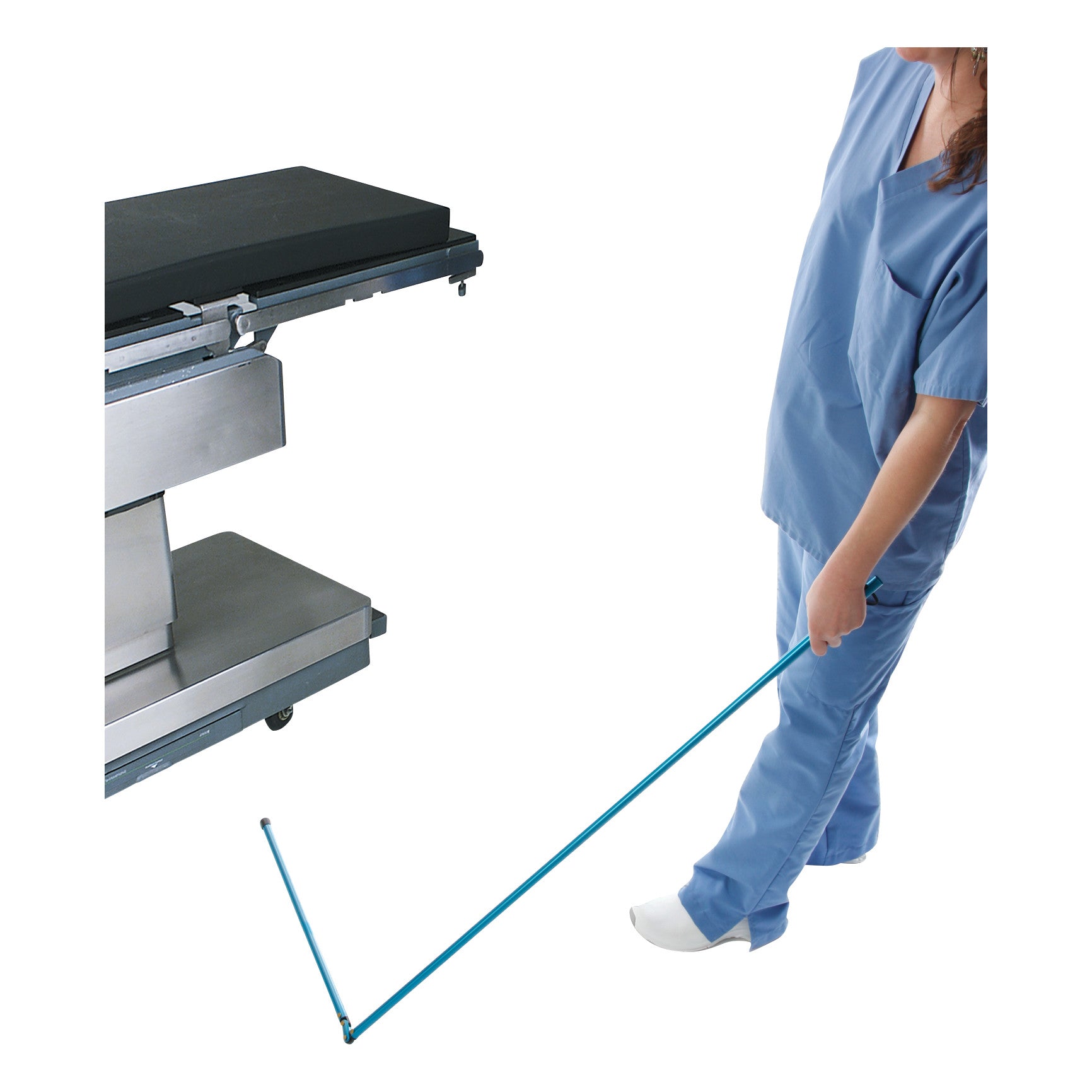 A person in blue scrubs uses the AliMed Low-Profile Magnetic Needle Finder on the floor near a metal hospital table.
