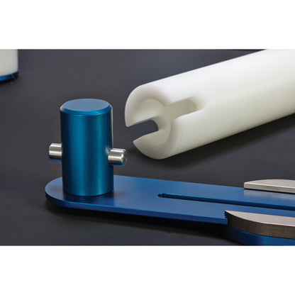 The AliMed Lateral Positioner Set, featuring a blue anodized metal component and a white cylindrical foam piece.
