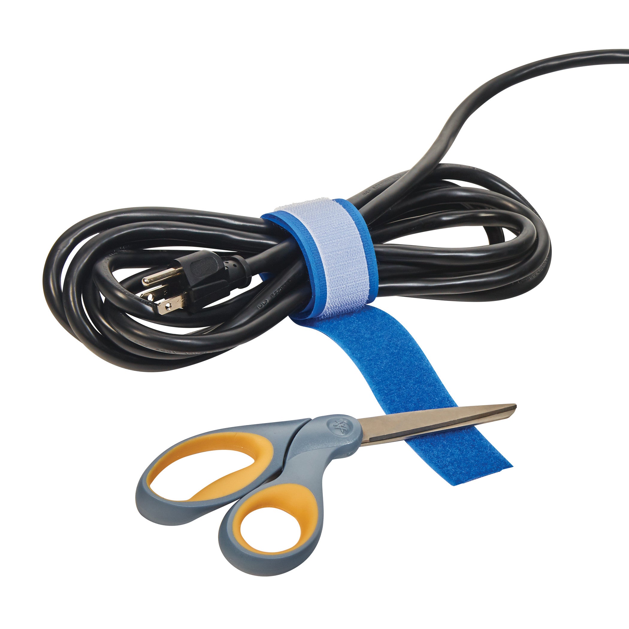 A coiled electrical cord secured with an AliMed AliStrap Precut Patient Safety Strap lies beside a pair of scissors.