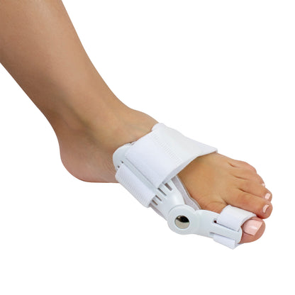 A foot wears the Silipos Day and Night Gel Bunion Splint, featuring white Velcro straps and a hinged joint near the big toe.