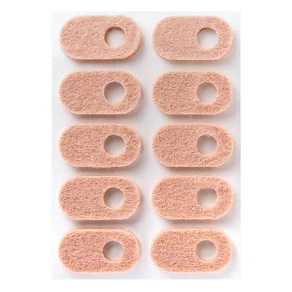 A sheet of PediFix FELTastic Corn Protector pads. The pads are peach-colored, oval-shaped, with a hole in the center.