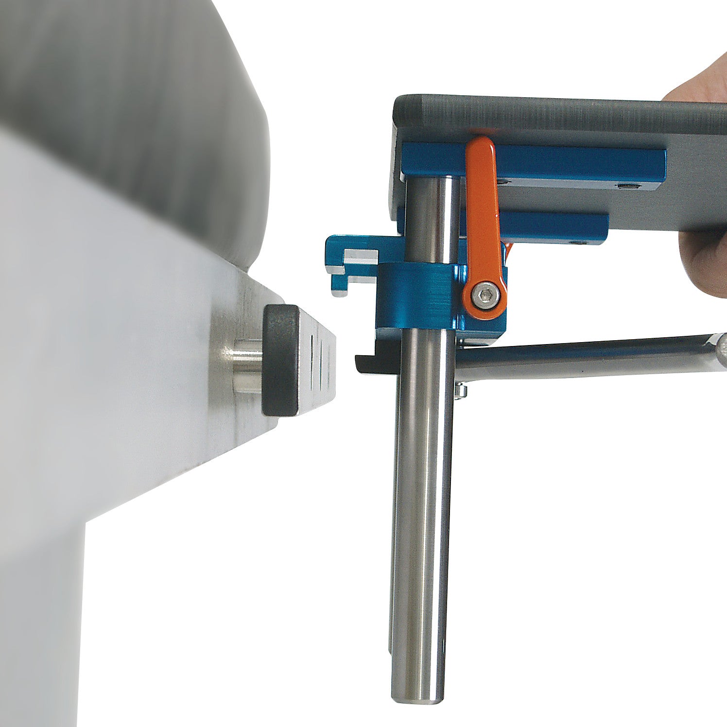 The AliMed Quick-Snap Table Clamp is shown securing a surface with a blue and orange clamp mechanism attached to a metal post.