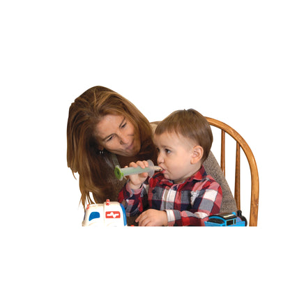 A child uses The Side Biter Chewing and Swallowing Therapy System, supervised by an adult. They are seated at a wooden chair.