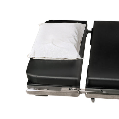An Action Gel Supine Head Pad placed on a black surgical table with metal frame edges.