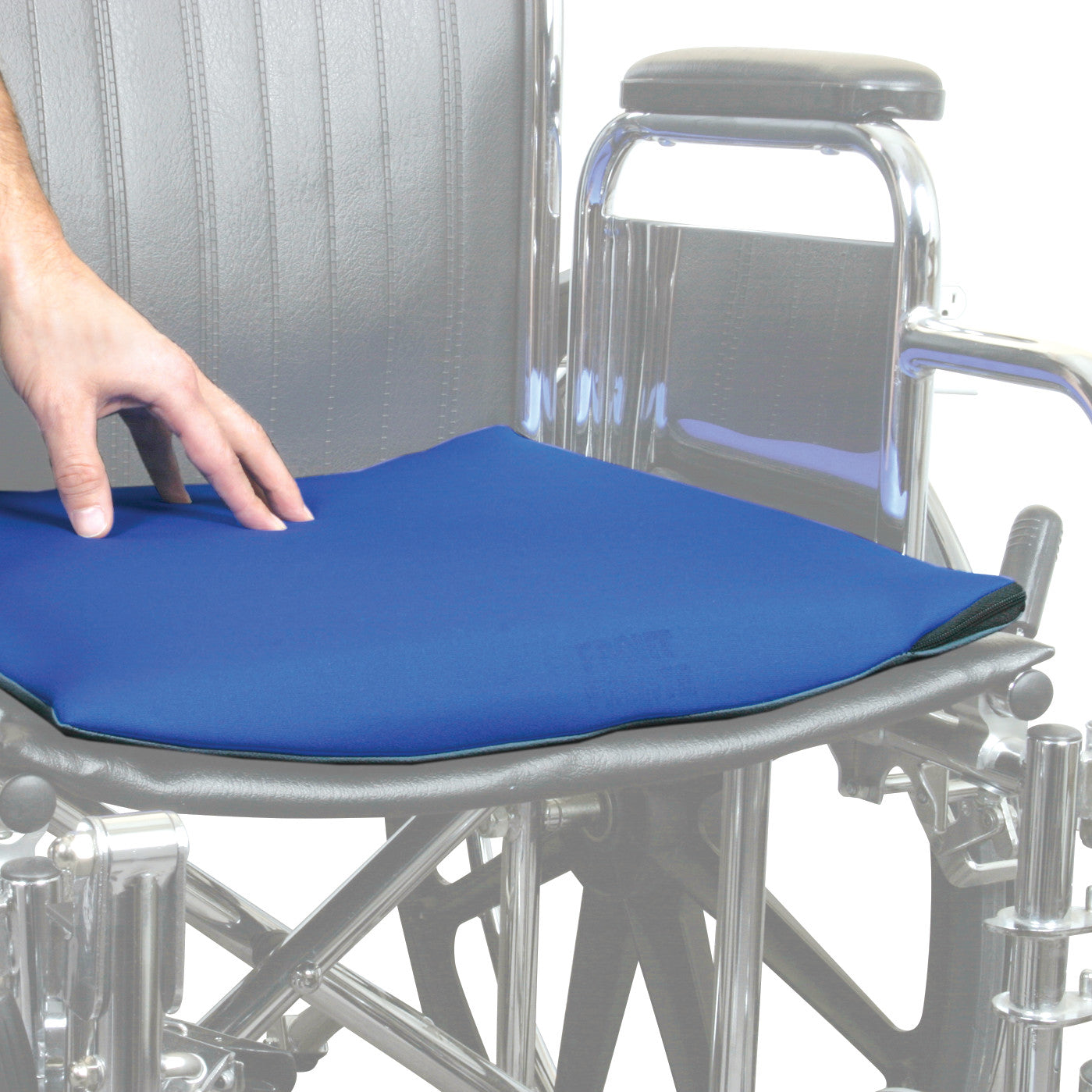 A hand adjusts the AliMed Stroke Wheelchair Cushion, a blue seat pad, on a wheelchair.