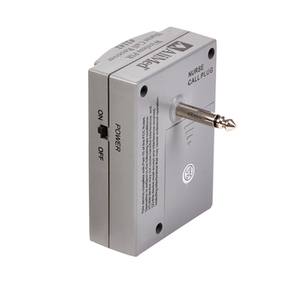 AliMed Nurse-Call Device with a grey rectangular body, a power switch labeled on/off, and a metal plug for connectivity.