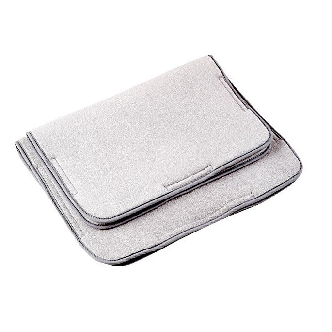 Two folded Chattanooga Hydrocollator Terry Covers in light gray, designed for heat therapy, with reinforced edges and closures.