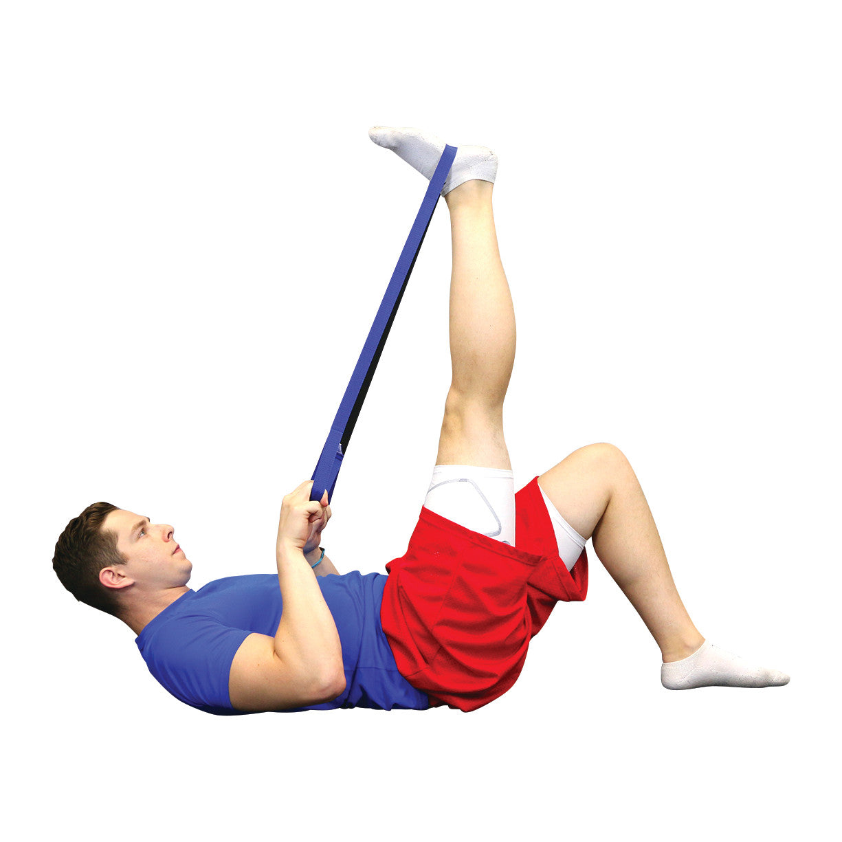 A person uses the CanDo Dynamic Stretch Strap to stretch their leg while lying on their back, wearing a blue shirt and red shorts.
