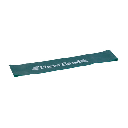THERABAND Resistance Band Loop in green lies flat, featuring the brand's logo in white lettering across its surface.