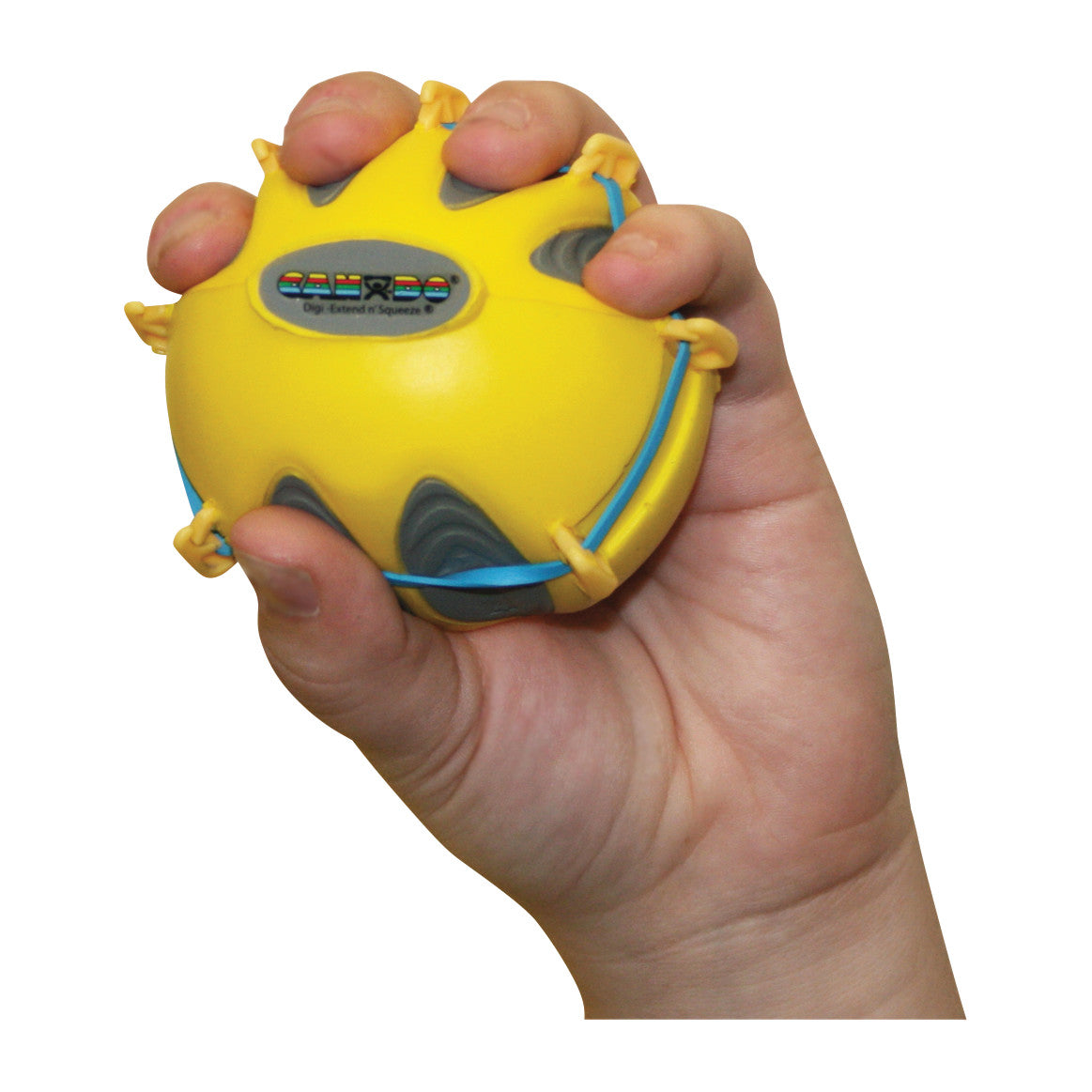 A hand holds a CanDo Digi-Extend n' Squeeze Hand Exerciser, a yellow ball with blue and gray details for hand exercise.