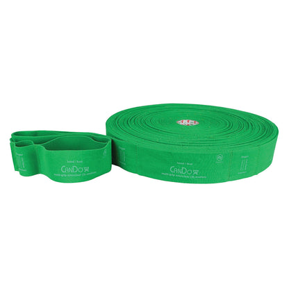 Green CanDo Multi-Grip Exerciser bands, coiled and folded, featuring hand and foot loops for versatile exercise use.