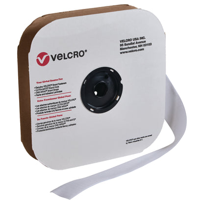 A roll of Standard VELCRO Brand Hook Tape on a brown and white spool, with text in multiple languages on the label.