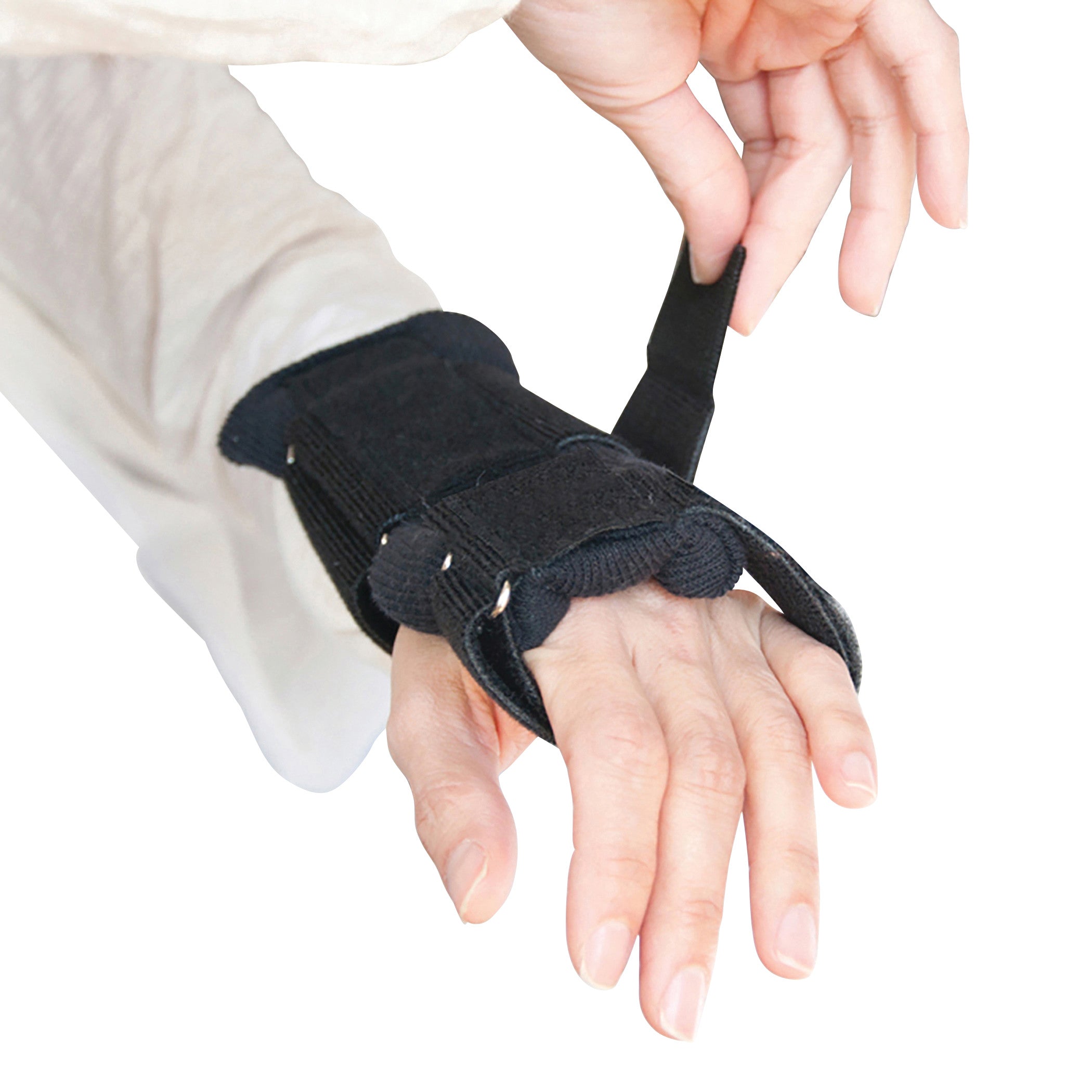 A person adjusts the Brownmed IMAK RSI WrisTimer PM Wrist Support on their wrist and hand.