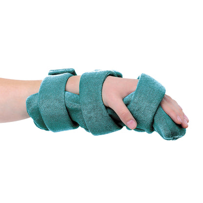 A hand wearing the Comfy Splints Pediatric Hand/Wrist Orthosis with teal straps wrapped securely for support.