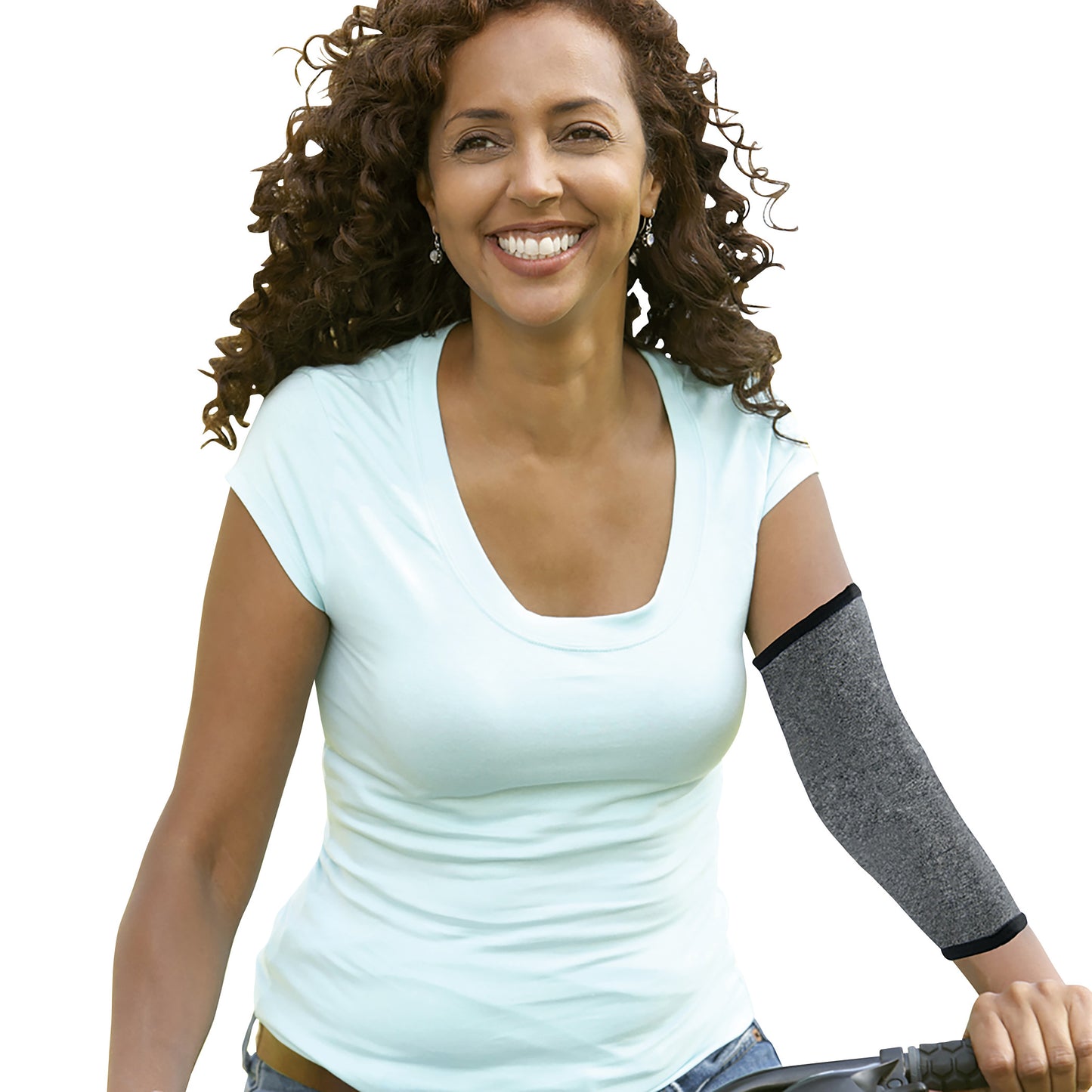 A woman smiles while wearing the Brownmed IMAK Compression Arthritis Elbow Sleeve. The sleeve is gray and covers her elbow.
