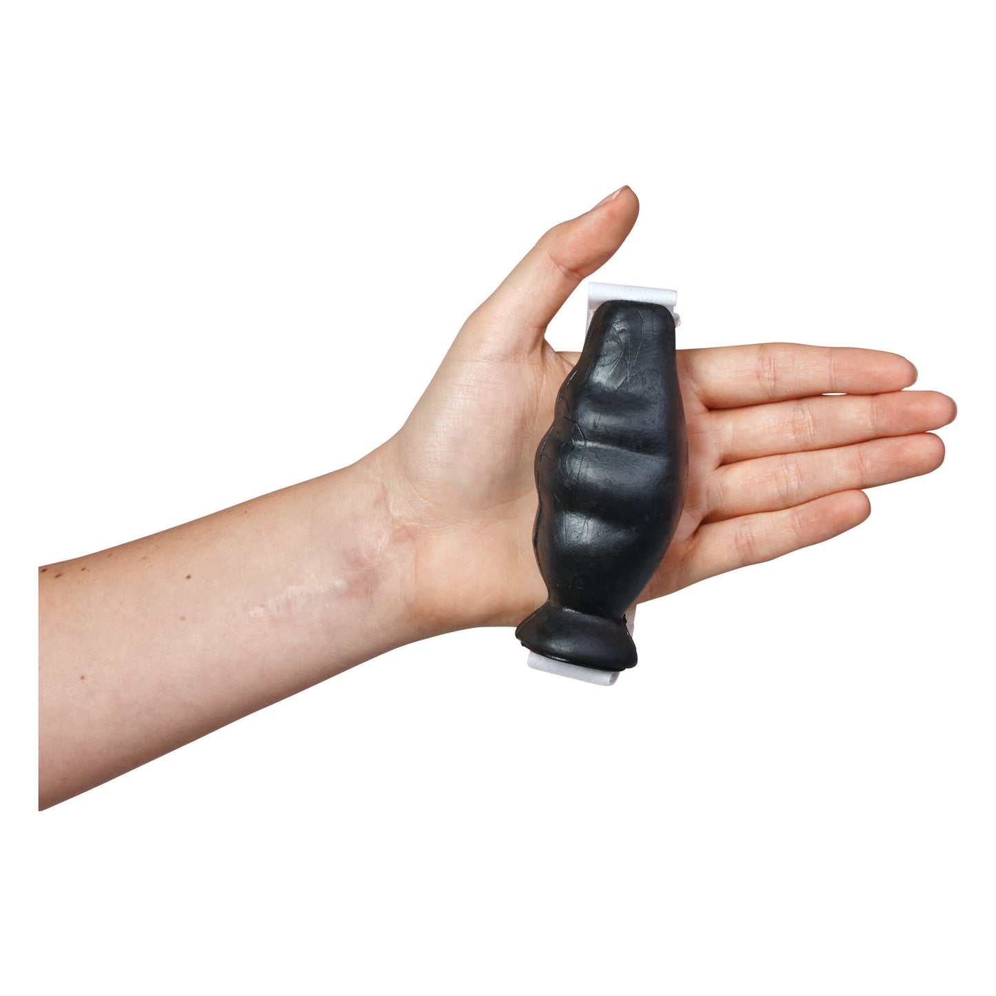 A hand holds the AliMed Swanson Hand Cone, a black, contoured device designed for hand therapy, featuring a loop at the end.