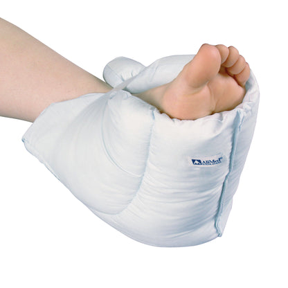 A bare foot rests in a padded AliMed Economy FootPillow, offering cushioning and support to the heel and ankle.