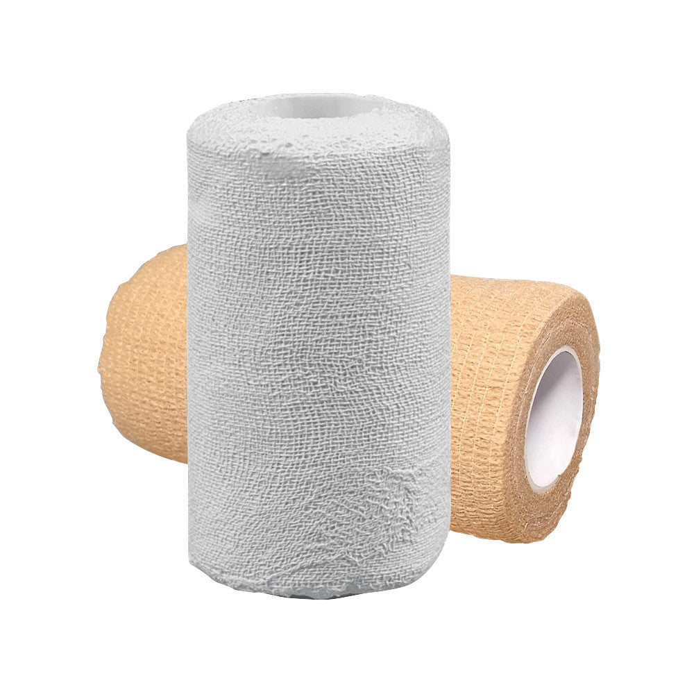 Two rolls of UNNA BOOT Zinc-Impregnated Gauze Kit, one beige and one white, with a textured surface and open centers.